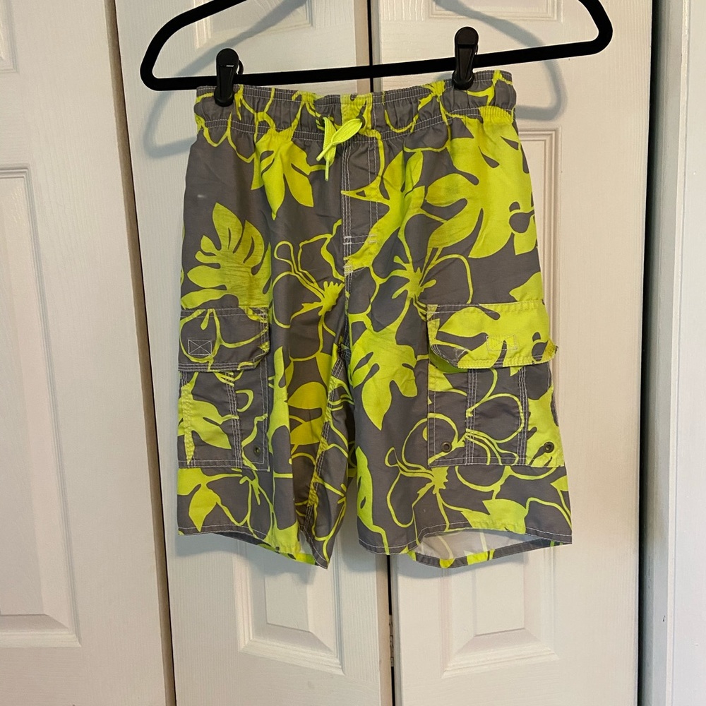 Grey and yellow tropical print boys swim trunk.